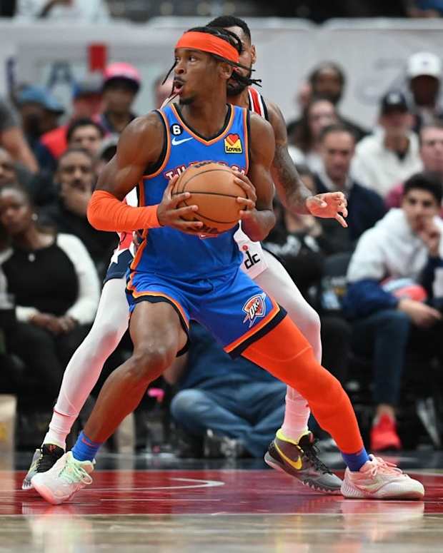 Nov 16, 2022; Washington, District of Columbia, USA; Oklahoma City Thunder guard Shai Gilgeous-Alexander (2) looks to shoot on Washington Wizards forward Kyle Kuzma (33) during the fourth quarter at Capital One Arena. Mandatory Credit: Tommy Gilligan-USA TODAY Sports